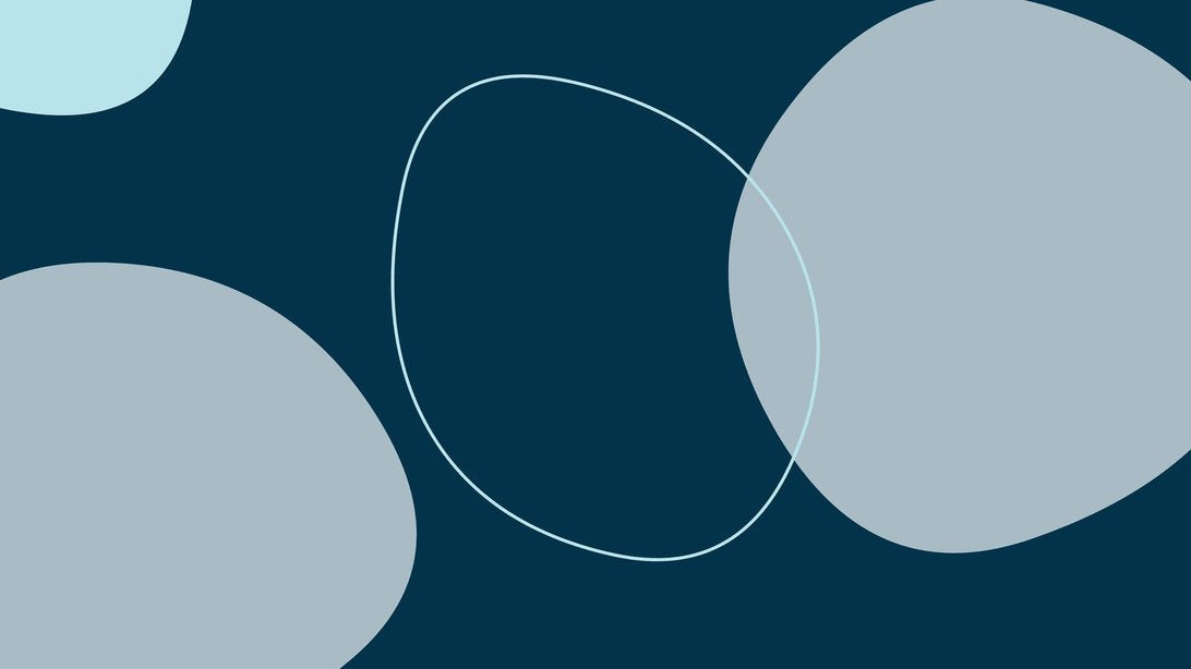 Close-up of abstract geometric circle pattern mural wallpaper in navy blue and gray