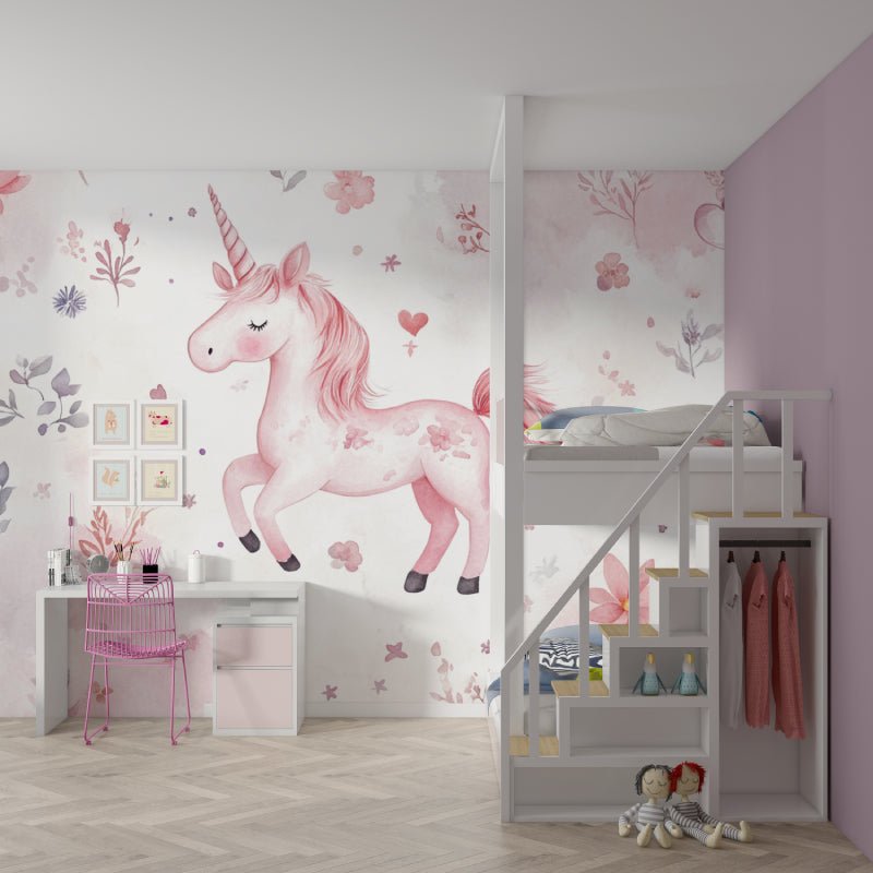 Pink unicorn mural wallpaper in children's bedroom with loft bed and study area