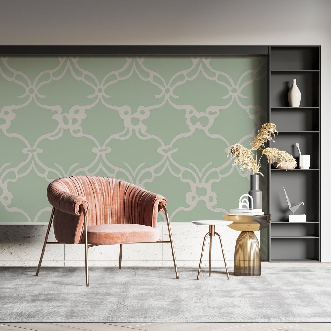 Art Deco geometric mural wallpaper featuring sage green pattern with pink velvet chair