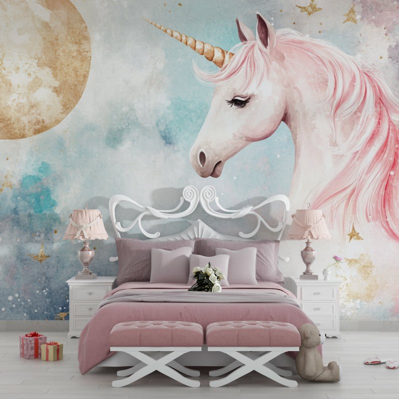 Magical unicorn mural wallpaper in pink watercolor with golden moon, shown in elegant bedroom setting