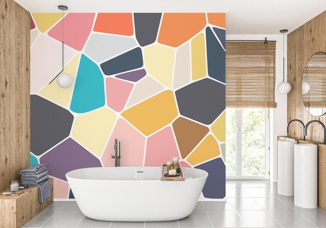Modern geometric mural wallpaper with multicolor mosaic pattern shown in a contemporary bathroom setting
