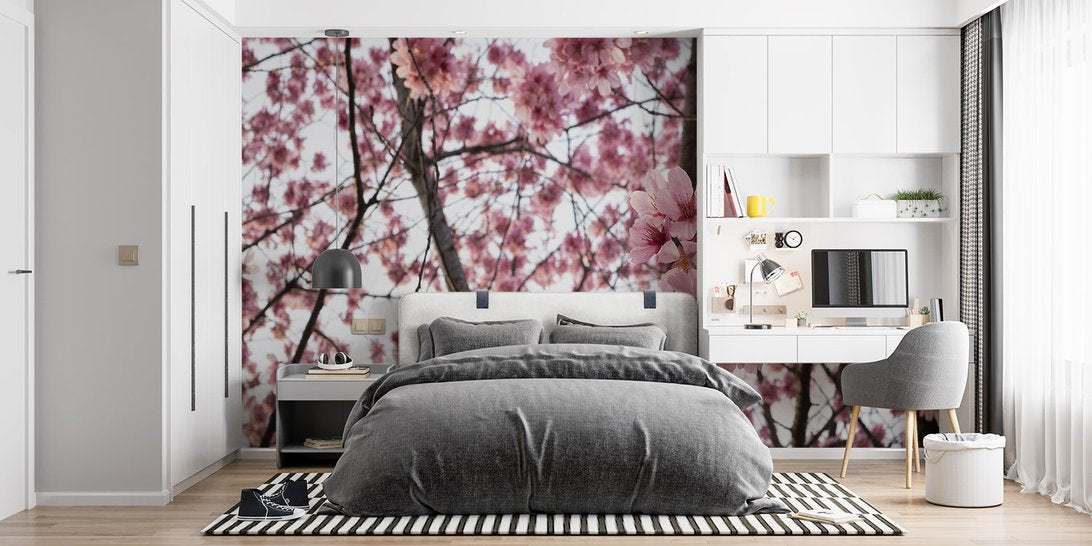 Japanese Cherry Blossom mural wallpaper in modern bedroom with grey bedding