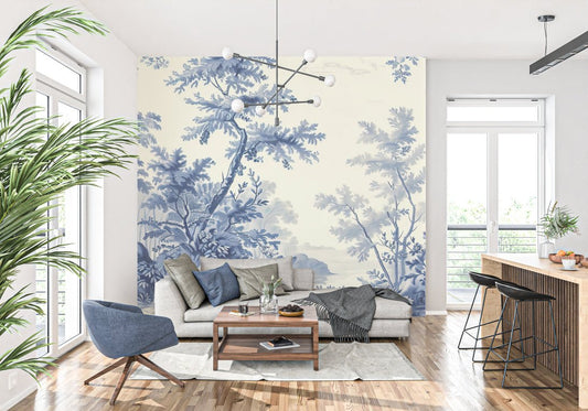 Blue Toile de Jouy tree mural wallpaper in modern living room with grey sofa and plants
