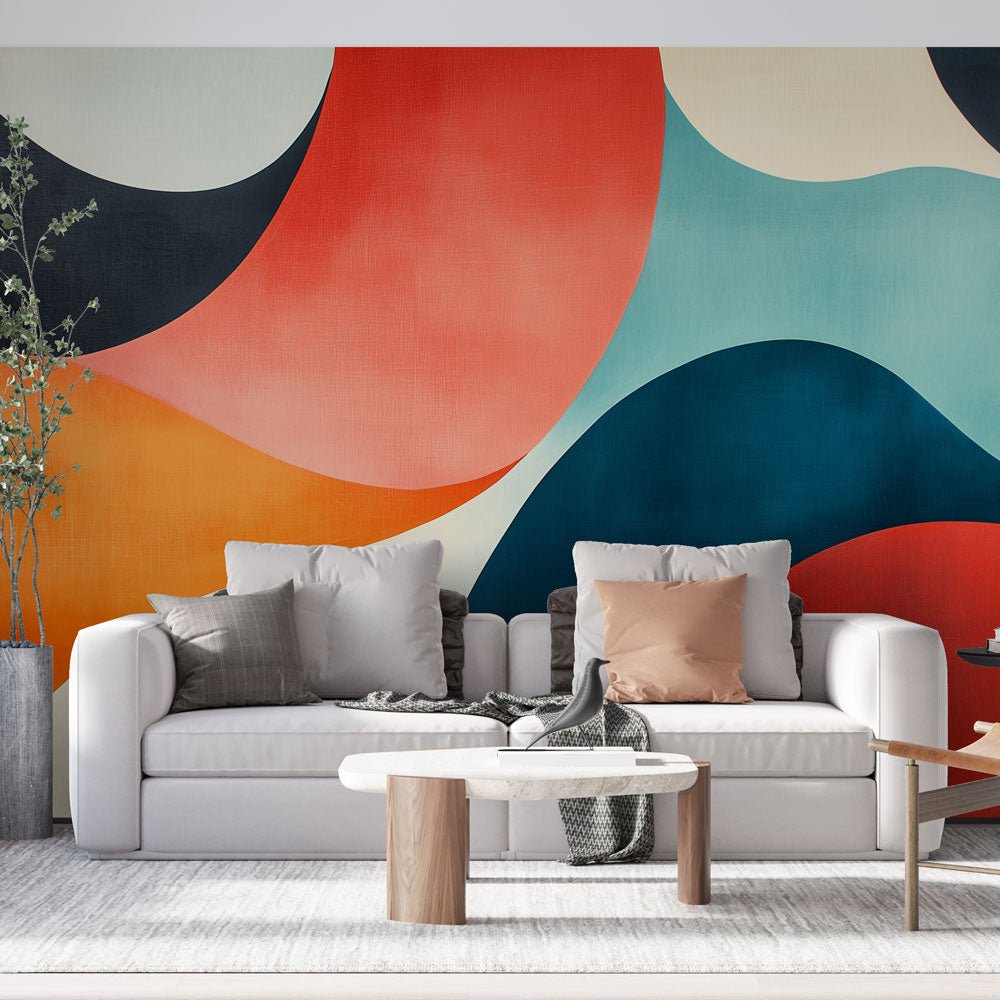 Modern abstract mural wallpaper with coral and turquoise waves in contemporary living room setting