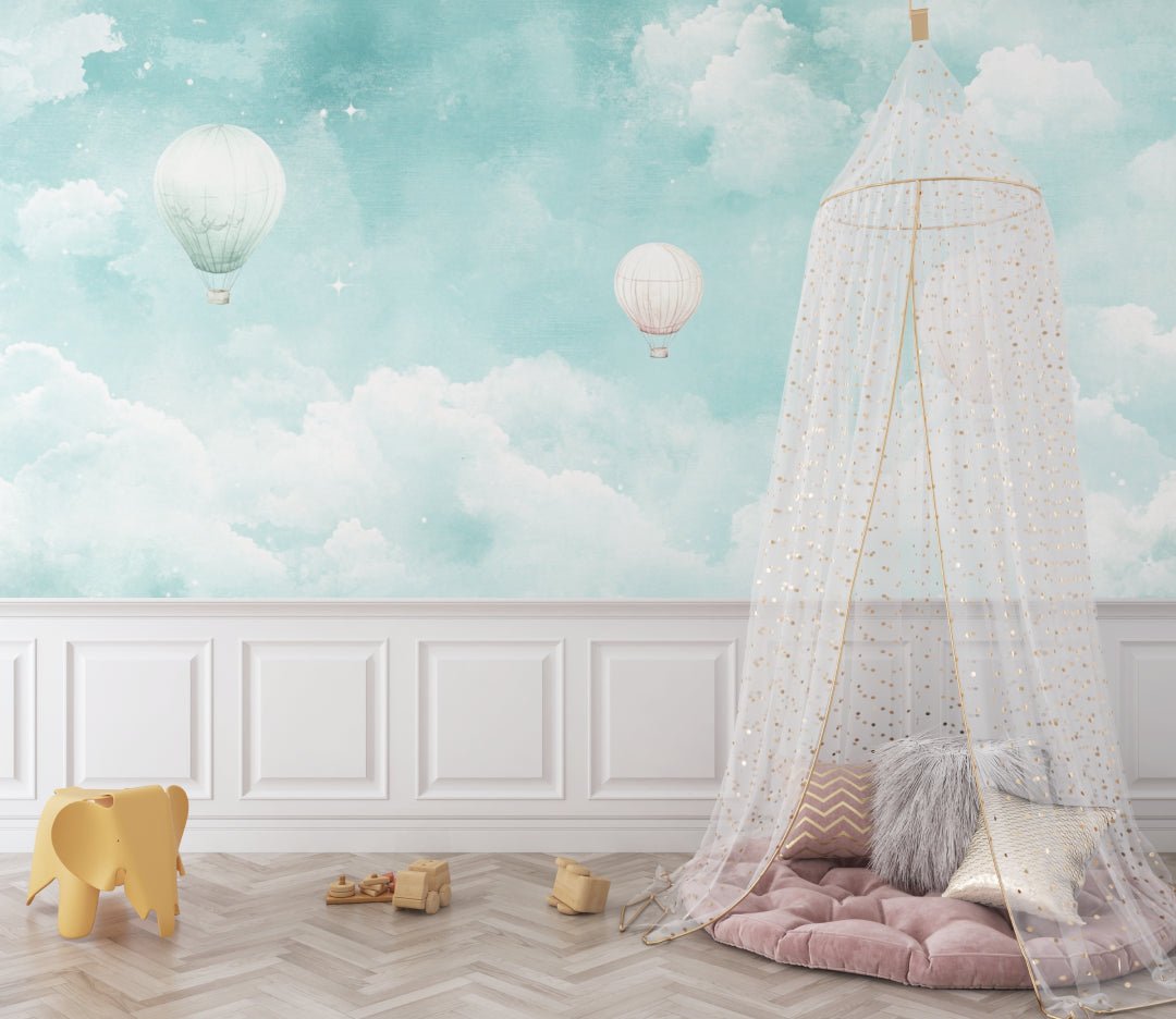 Turquoise sky mural wallpaper with floating hot air balloons in nursery setting