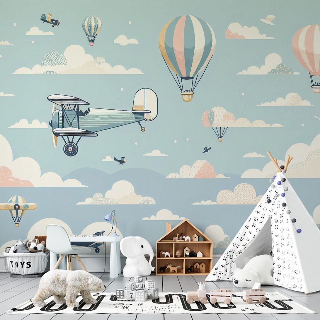 Vintage aviation mural wallpaper with hot air balloons and biplanes in pastel colors shown in nursery setting