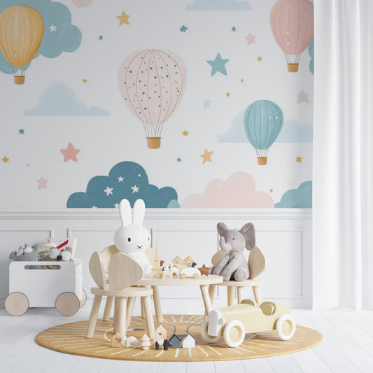 Hot air balloon nursery mural wallpaper with pastel design and Scandinavian furniture setting