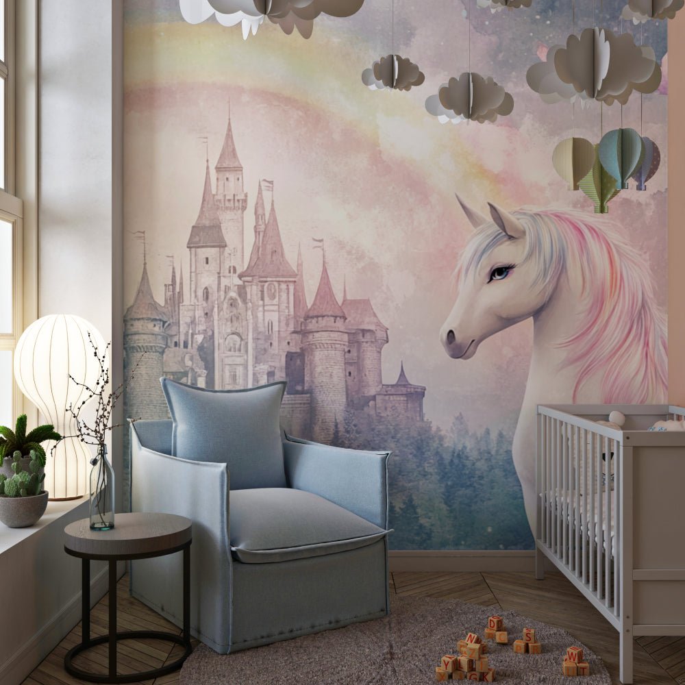 Unicorn castle mural wallpaper displayed in modern nursery with gray armchair