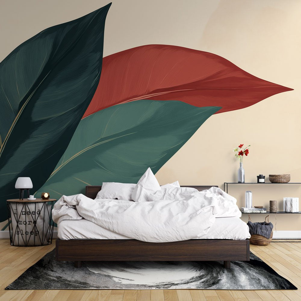 Oversized botanical mural wallpaper with forest green and terracotta leaves in a modern bedroom setting