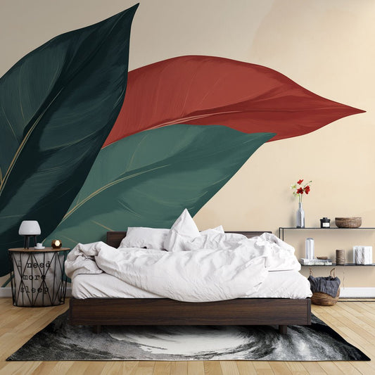Oversized botanical mural wallpaper with forest green and terracotta leaves in a modern bedroom setting