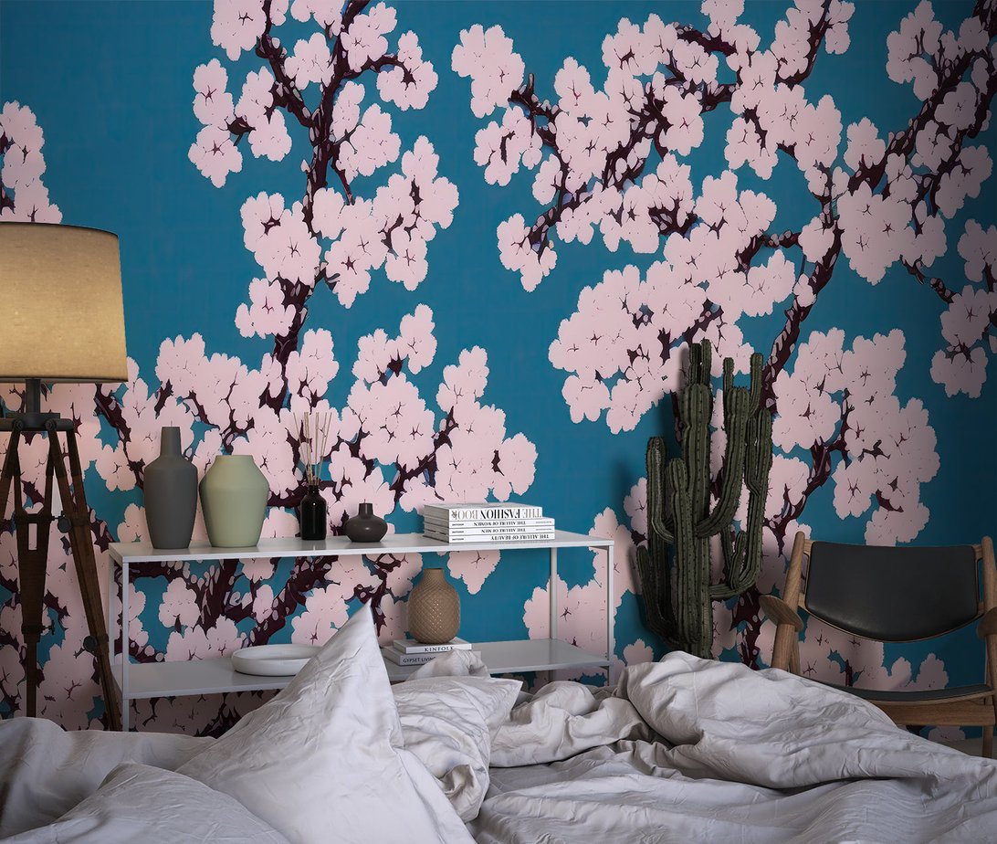 Japanese cherry blossom mural wallpaper in bedroom with modern decor and cactus plant