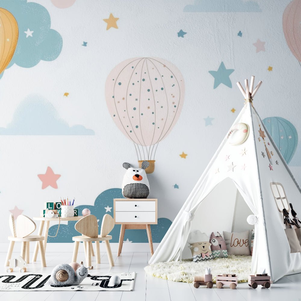 Nursery room with hot air balloon wall mural featuring teepee tent and wooden furniture