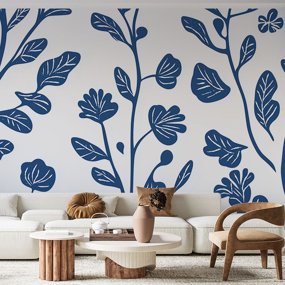 Modern botanical mural wallpaper with navy blue leaves pattern in contemporary living room setting