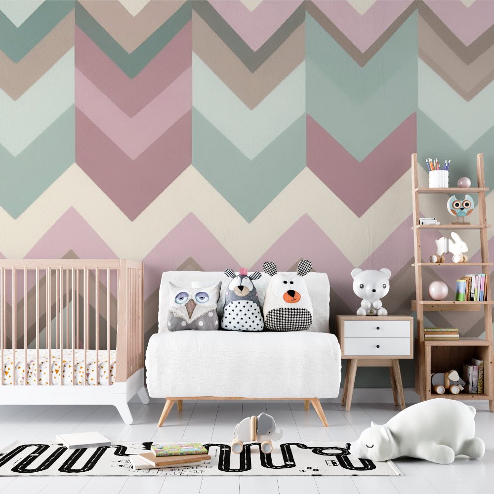 Nursery room featuring geometric chevron mural wallpaper with modern white crib and plush toys