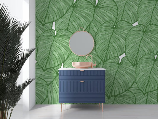 Modern bathroom vanity against XXL Monstera leaf mural wallpaper in natural green