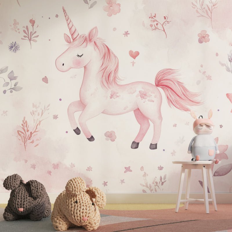 Pink unicorn mural wallpaper with floral details and decorative stuffed animals