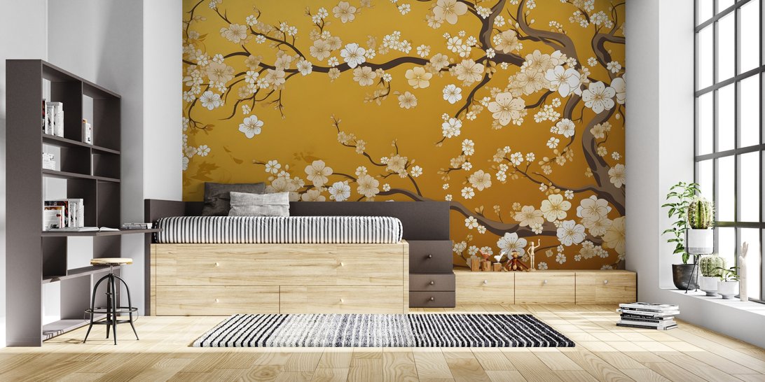 Japanese cherry blossom mural wallpaper in modern bedroom with platform bed and wooden storage