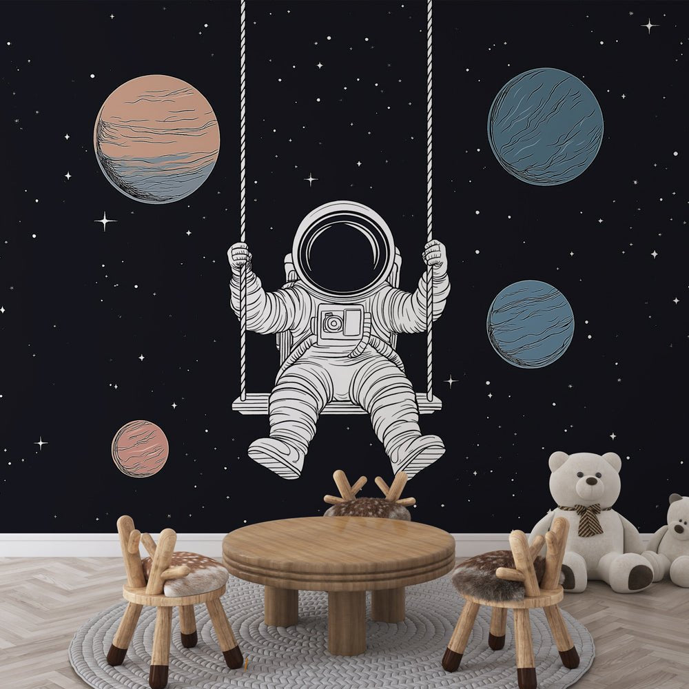 Astronaut on swing mural wallpaper with floating planets in nursery setting