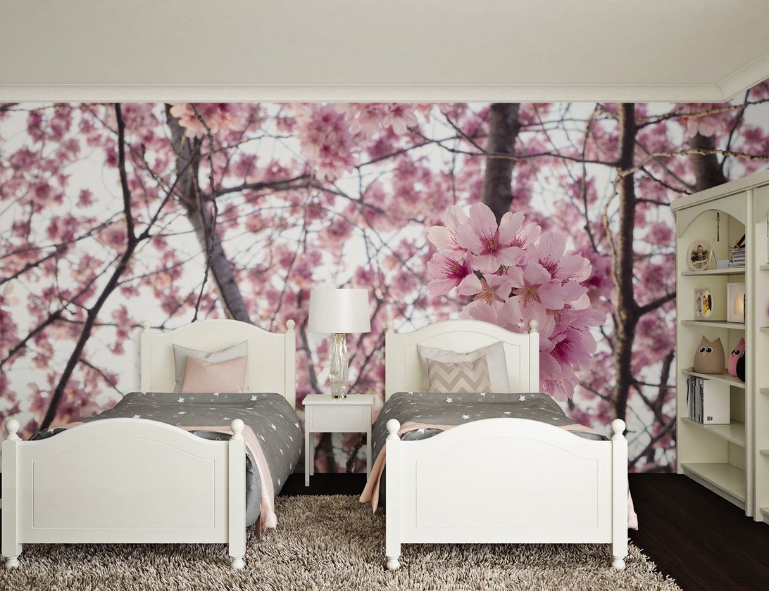 Pink Sakura mural wallpaper installation in minimalist room setting