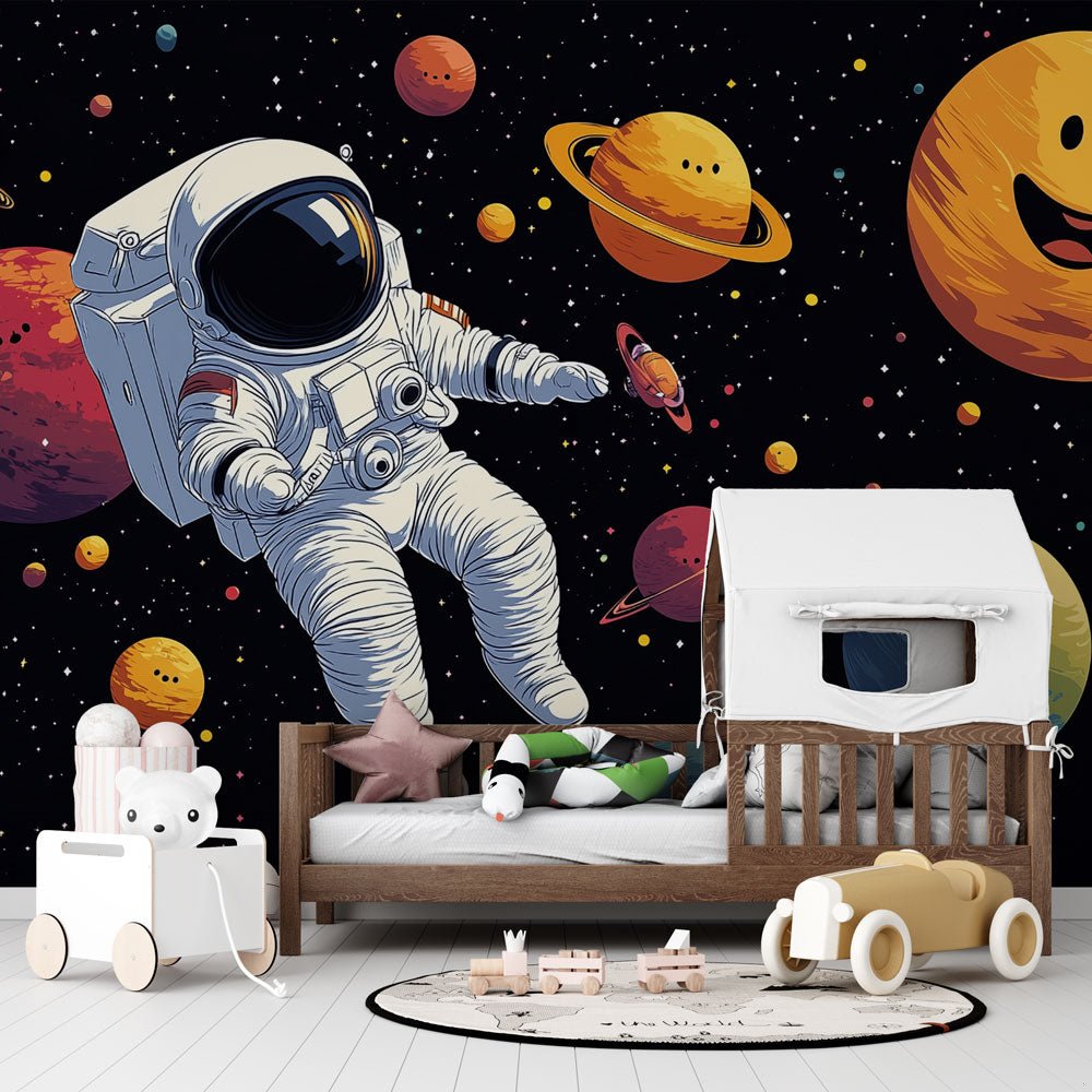 Space Explorer mural wallpaper showing astronaut and smiling planets in kids room setting