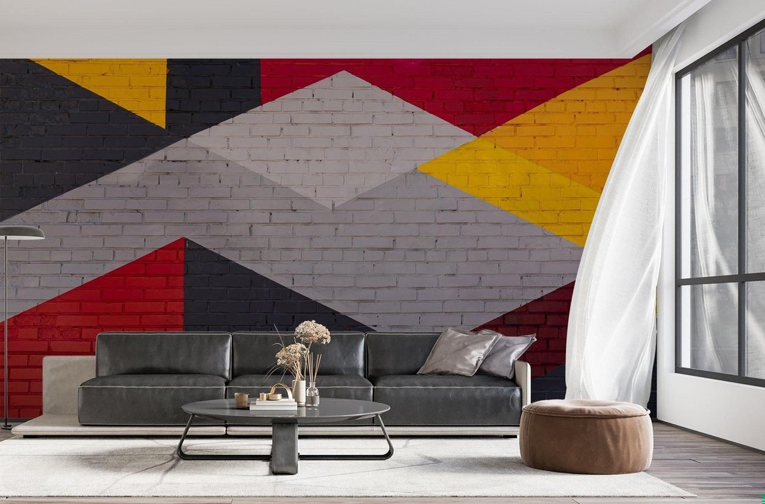 Geometric brick mural wallpaper with red and yellow diamonds in living room
