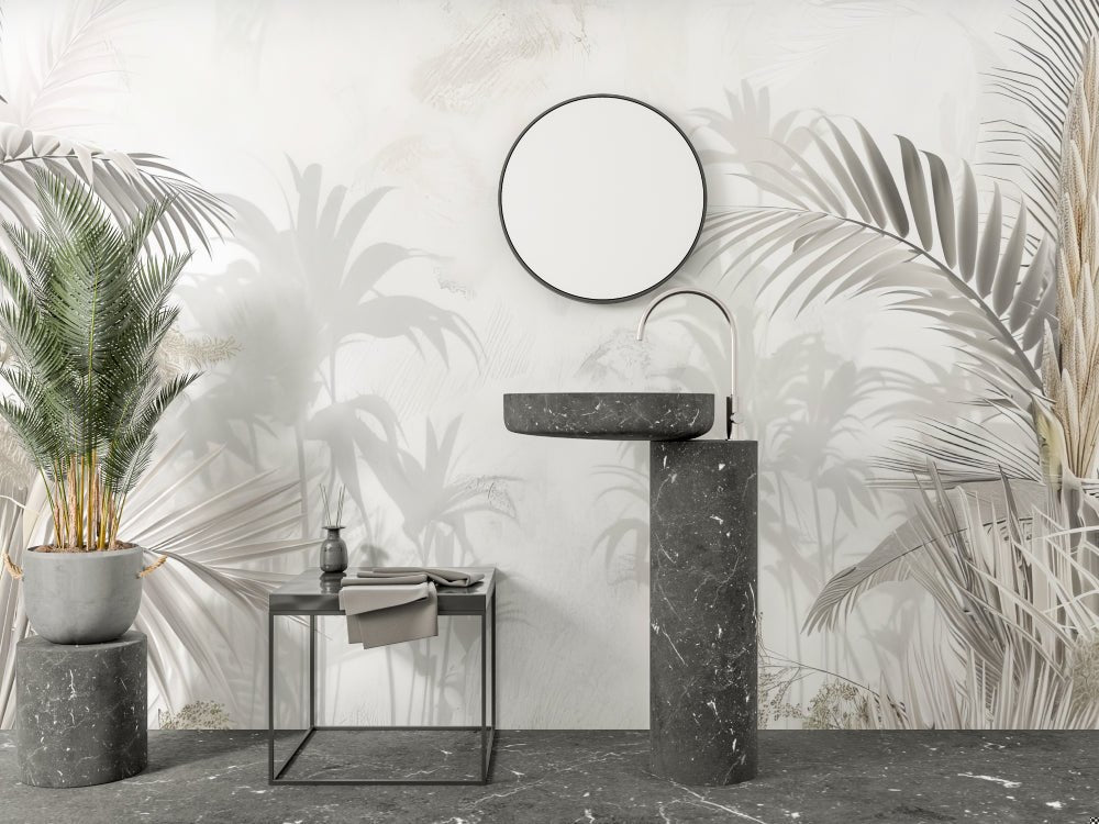 Modern bathroom sink with minimalist design against palm leaves mural wallpaper