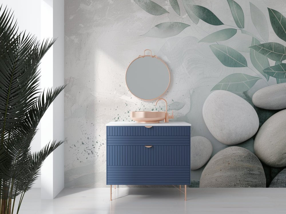 Modern vanity with blue cabinet against sage leaf and pebble mural wallpaper