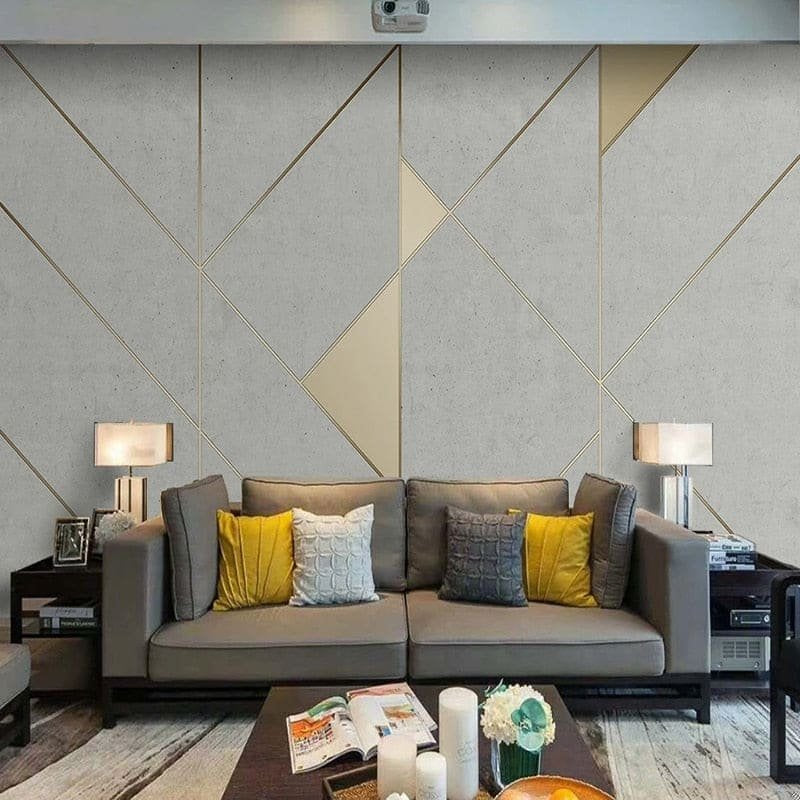 Close-up detail of grey and gold geometric pattern mural wallpaper