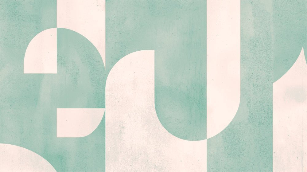 Close-up of Art Deco geometric pattern with mint green and cream curved shapes