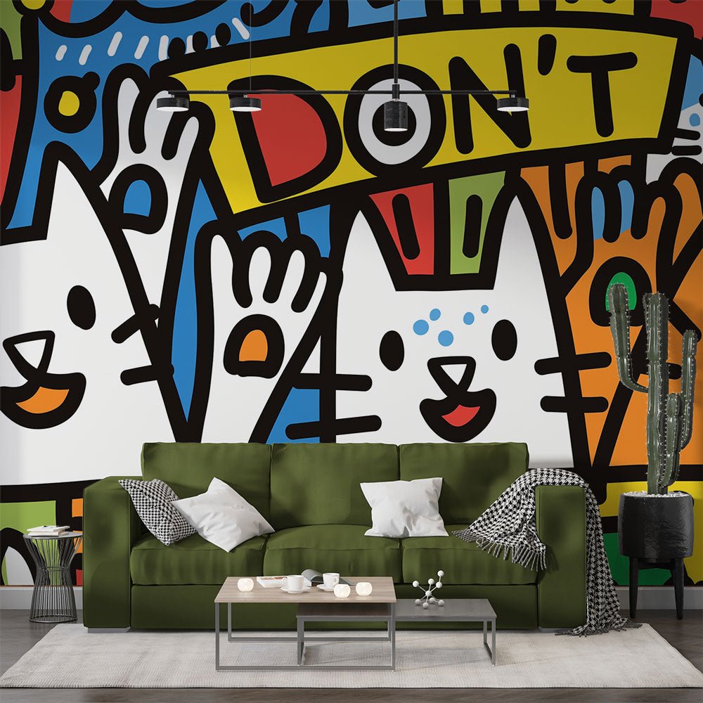 Street art cats graffiti mural wallpaper displayed in modern living room with green sofa