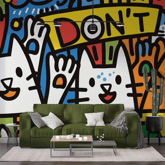 Street art cats graffiti mural wallpaper displayed in modern living room with green sofa